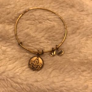 Gold Alex and Ani fleur de lis bracelet